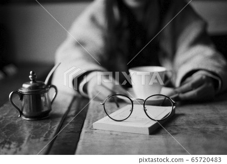 Glasses and coffee shop 65720483