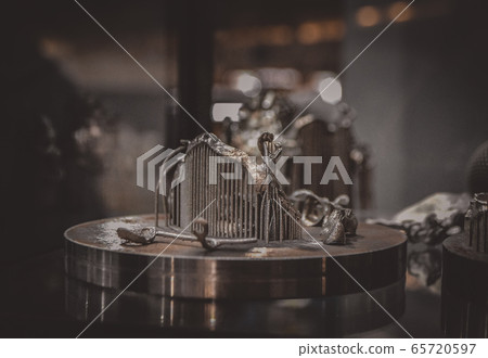 Object printed on metal 3d printer close-up. Object printed on metal 3d printer close-up. 65720597