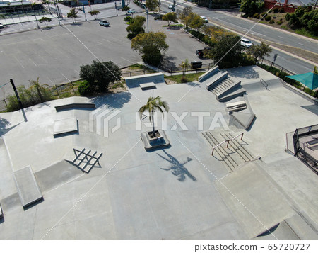 Aerial view of outdoor empty concrete skate park with ramps Aerial view of outdoor empty concrete skate park with ramps 65720727