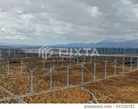Aerial view of huge array of gigantic wind turbines spreading over the desert in Palm Springs. 65720781