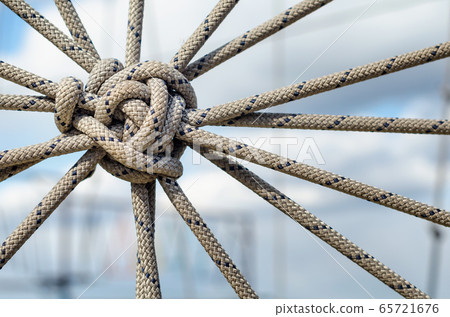 many ropes and one big knot close up many ropes and one big knot close up 65721676