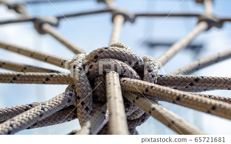 many ropes and one big knot close up 65721681