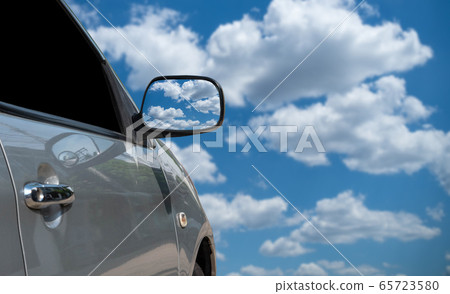 Car side mirror Sky view In travel 65723580