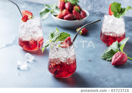 Red cocktail with ice and fresh strawberry Red cocktail with ice and fresh strawberry 65723728