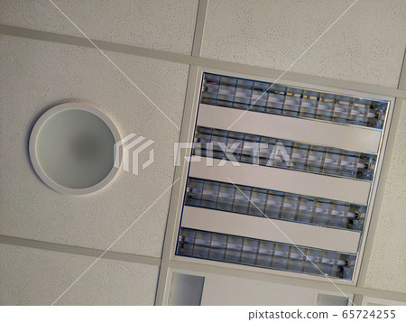 Acoustic panel and light fixtures in t-bar grid of suspended ceiling Acoustic panel and light fixtures in t-bar grid of suspended ceiling 65724255