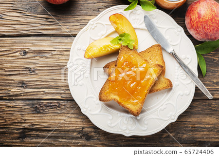 Healthy breakfast with toast and peach jam 65724406