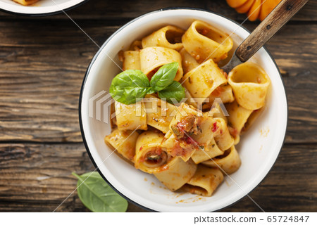 pasta calamarata with vegetarian sauce 65724847