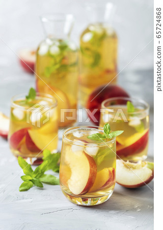 Summer cold tea with peaches and mint Summer cold tea with peaches and mint 65724868