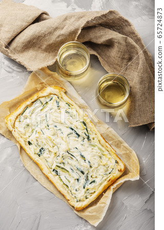homemade tart with ricotta and zucchini 65724873