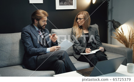 Two business people discussing ideas Two business people discussing ideas 65725379