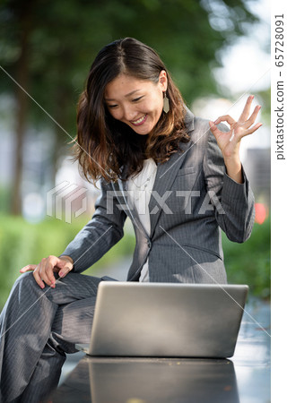 Businesswoman celebrate success Businesswoman celebrate success 65728091