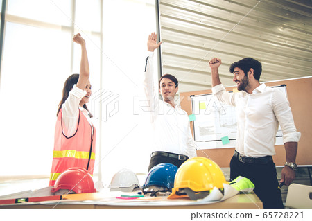 Success group engineers with lift hand together in Success group engineers with lift hand together in 65728221