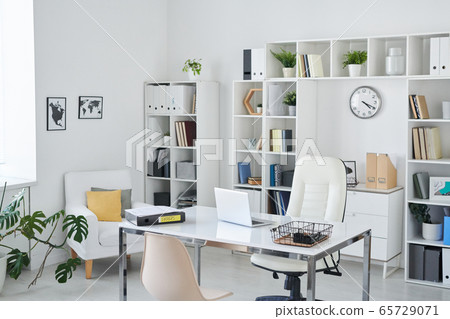 Office of business person with desk, armchair of professional, chair for clients Office of business person with desk, armchair of professional, chair for clients 65729071