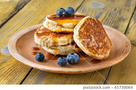 Stack of ricotta pancakes on the plate 65730069