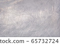 Worn metal plate steel background. Silver foil. 65732724