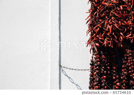 Red hot spicy dried chilli peppers paprika on wall in Szentendre, Hungary Red hot spicy dried chilli peppers paprika on wall in Szentendre, Hungary 65734610