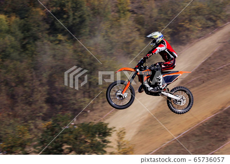 The motorcyclist in flight. Motocross. Sports. In 65736057