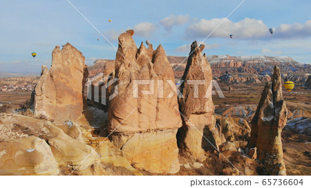 Beautiful Nature of Cappadocia on with balloons on a background of camel rocks. Turkey. Beautiful Nature of Cappadocia on with balloons on a background of camel rocks. Turkey. 65736604