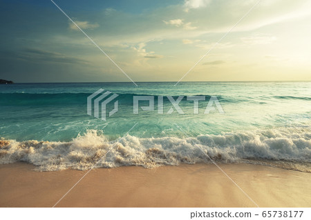 perfect sunset on Seychelles beach 65738177