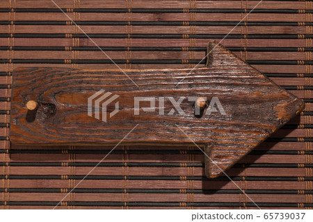 Wooden pointer made of wood with a wooden gag lie 65739037