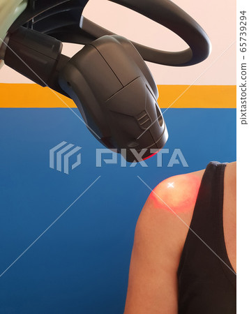 Physical therapy using a laser to treat an injured 65739294