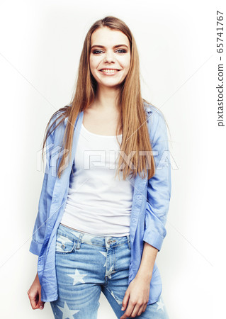 young pretty teenage hipster girl posing emotional happy smiling on white background, lifestyle people concept 65741767