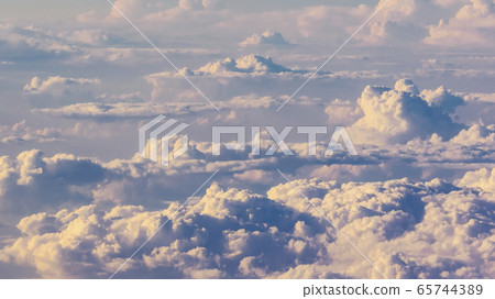 White cumulus clouds on clear blue sky background closeup White cumulus clouds on clear blue sky background closeup 65744389