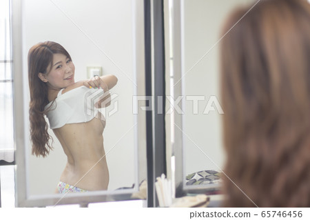 beautiful young woman ,taking off her white shirt beautiful young woman ,taking off her white shirt 65746456
