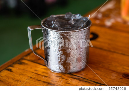 Water in aluminum glass, water droplets adhering Water in aluminum glass, water droplets adhering 65748926