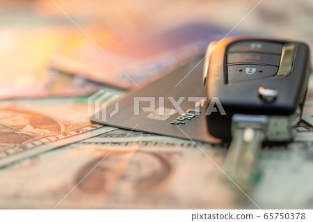 New car keys, credit card and US dollar banknote 65750378