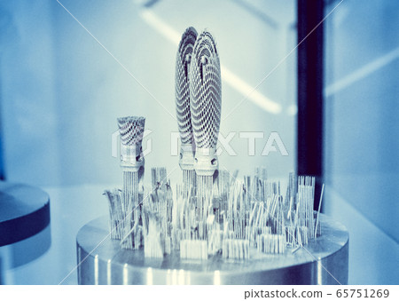 Object printed on metal 3d printer close-up Object printed on metal 3d printer close-up 65751269