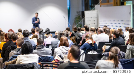 Business speaker giving a talk at business conference event. Business speaker giving a talk at business conference event. 65753986