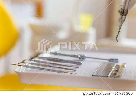 Medical equipment and stomatology concept, yellow dentistry Medical equipment and stomatology concept, yellow dentistry 65755809