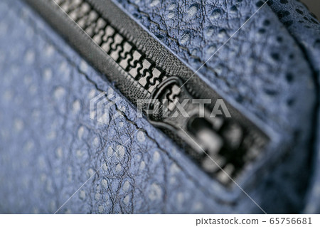 Zipper slider for a blue textured leather bag. Zipper slider for a blue textured leather bag. 65756681