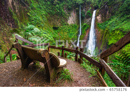 Empty bench at the Catarata del Toro waterfall in Costa Rica 65758176