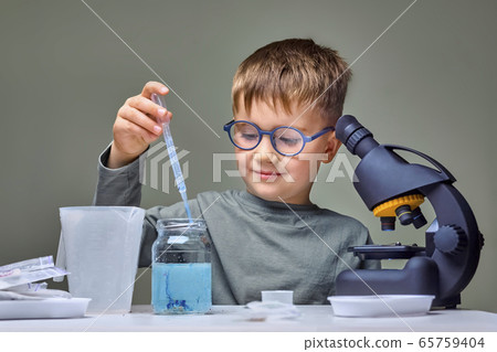 Studying remotely online. Toddler genius baby. Studying remotely online. Toddler genius baby. 65759404