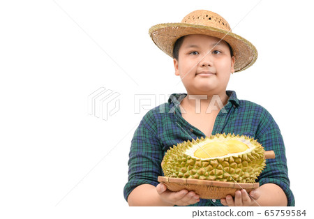 Cute boy farmer is holding durian on basket Cute boy farmer is holding durian on basket 65759584