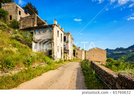 Ruined buildings of an abandoned city. 65760632