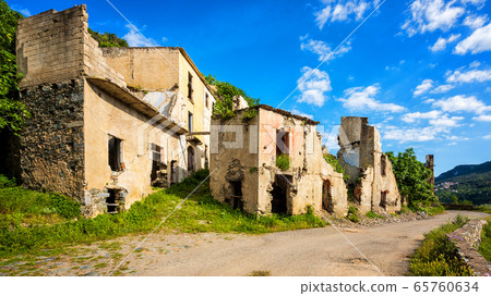 Ruined buildings of an abandoned city. Ruined buildings of an abandoned city. 65760634