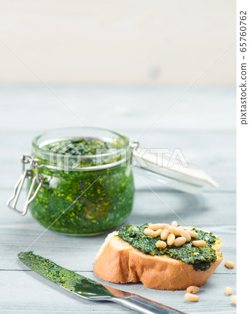 baguette bread with fresh pesto 65760762