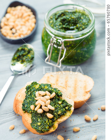 baguette bread with fresh pesto 65760780