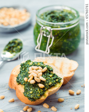 baguette bread with fresh pesto 65760781