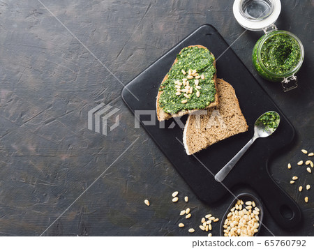 whole grain rye bread with fresh pesto 65760792