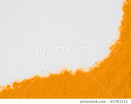 Turmeric Powder on white with copy space 65761512