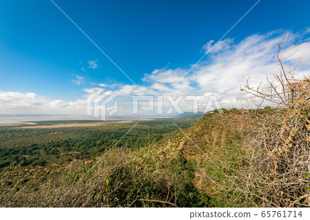 A vast original landscape and blue sky found in Tanzania during a trip to Africa A vast original landscape and blue sky found in Tanzania during a trip to Africa 65761714