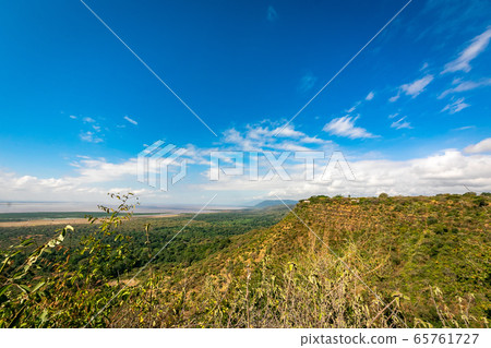 A vast original landscape and blue sky found in Tanzania during a trip to Africa A vast original landscape and blue sky found in Tanzania during a trip to Africa 65761727
