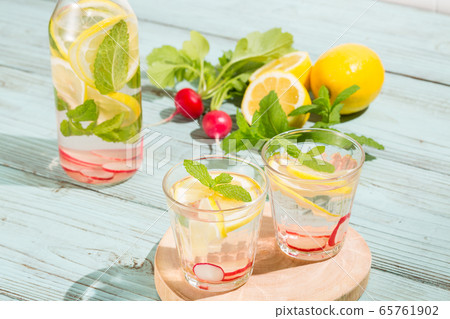 Detox water with lemon, mint and radish-infused water 65761902