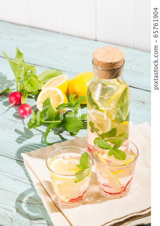 Detox water with lemon, mint and radish-infused water 65761904
