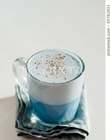 Blue pea latte or blue matcha latte with copy space Blue pea latte or blue matcha latte with copy space 65762031