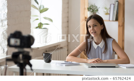 Young female coach shoot live broadcast on camera Young female coach shoot live broadcast on camera 65762424